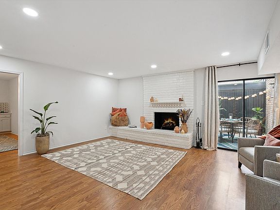 Large living room with fireplace and private patio!