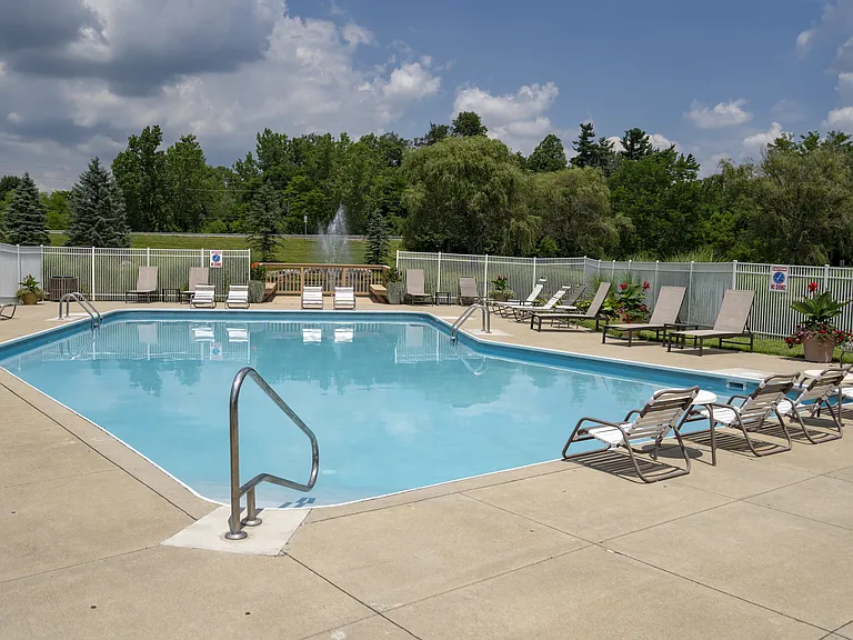 Lounge, swim, and enjoy the outdoors at the spacious community pool, perfect for relaxation and fun.