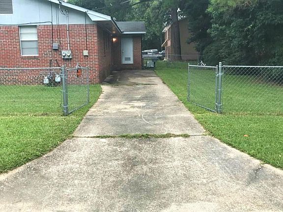 Private Driveway Entrance and Backyard