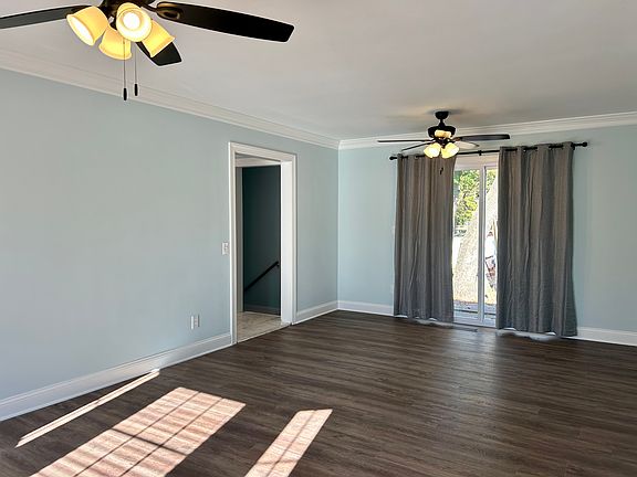 Living room facing sliders to patio in rear
