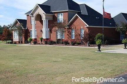 Back View
						:
						2 covered porches and inground salt water pool.