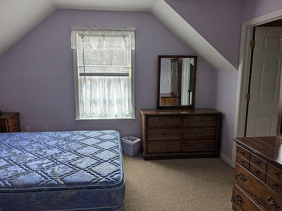 master bedroom with attached walk in closet and laundry room