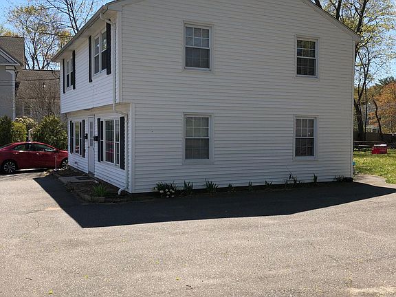 House setback from road leading to private park-like rear yard.
