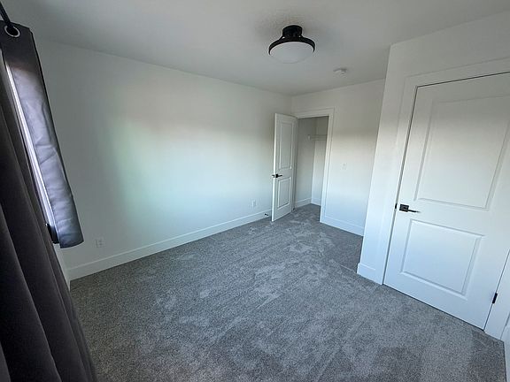 The bedroom available on the top floor of a newly built home near Nike, Costco, and 2 train stations.