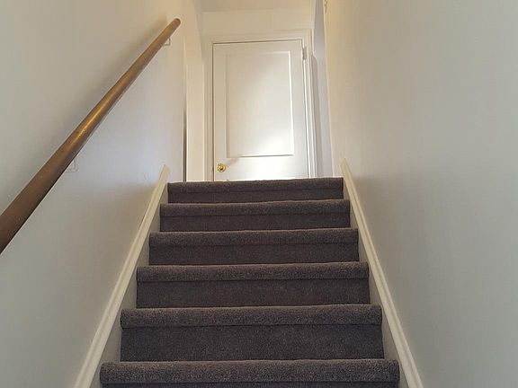 Inside stairway with new carpet throughout