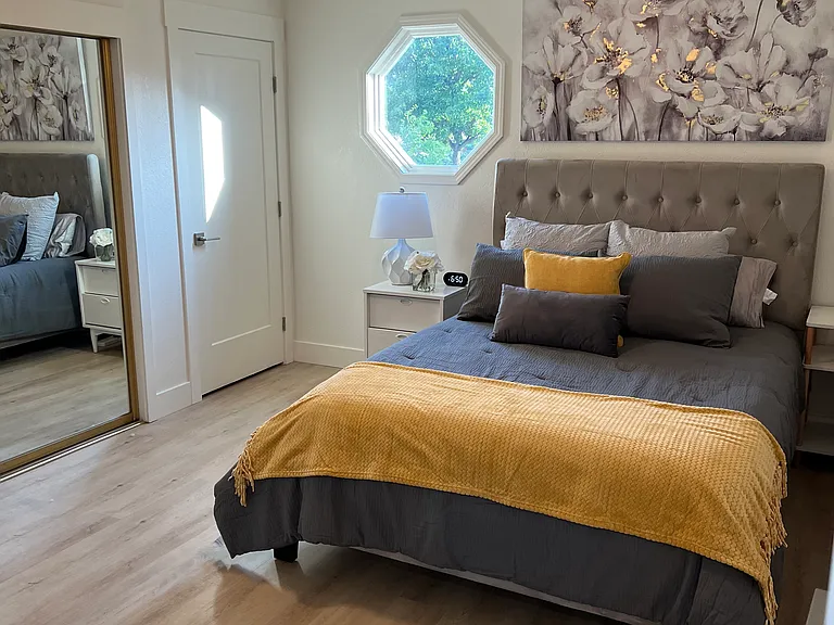 Master Bedroom with large closet and small storage closet. The adjustable celing fan is beautiful and great for temperature control.