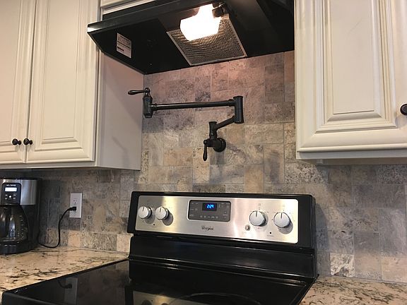 Pot filler above Stove