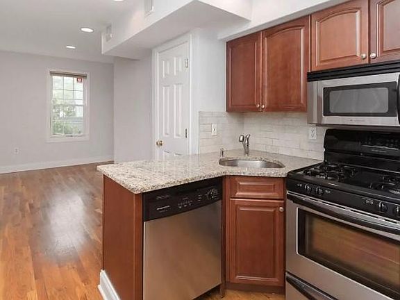 Kitchen with view into living room