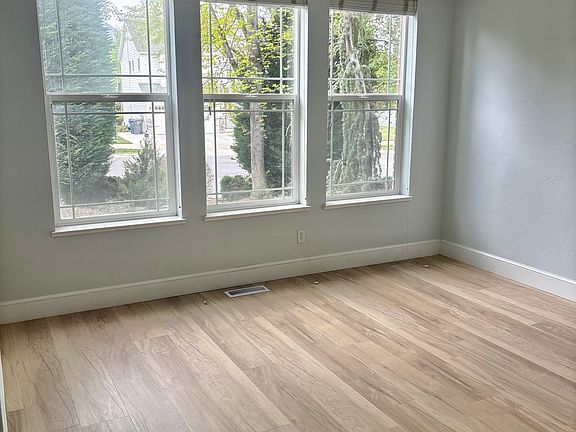 Sitting area to the right of the front door, new plank flooring