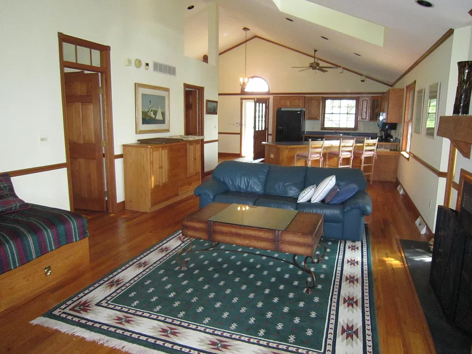 LR/Great Room facing Kitchen & Front Door w/ MBR Door & Laundry Room Door on left