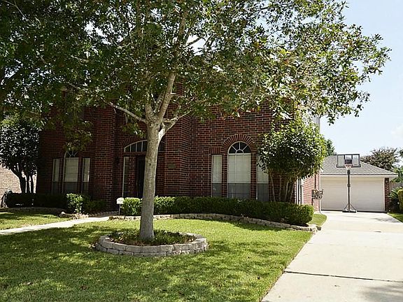 There is a two car detached garage with extra long driveway.