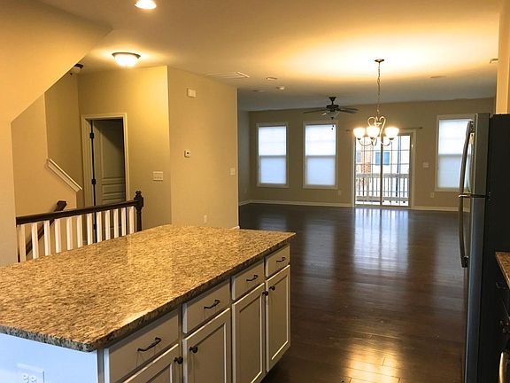 View into dining area, living room & balcony from the kitche