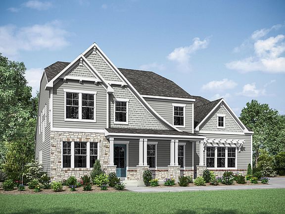 two-story home with siding, stone and shakes