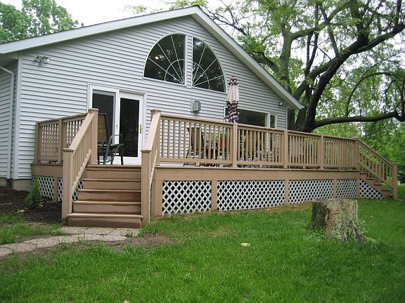 Back of house with deck