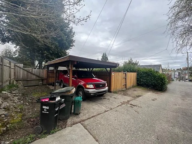 Car port / second off street parking spot along fence.