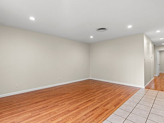 Living room and hallway with new recessed lighting