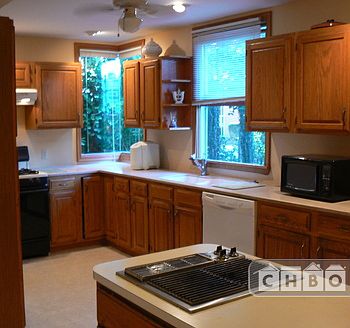 gourmet kitchen with Jenn Aire indoor grill on island