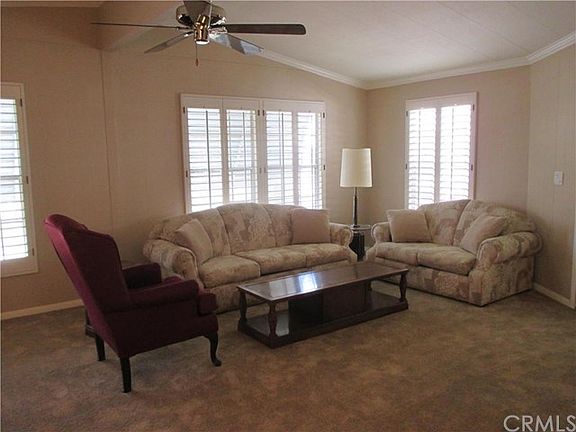 Living Room with plantation shutters and new carpet