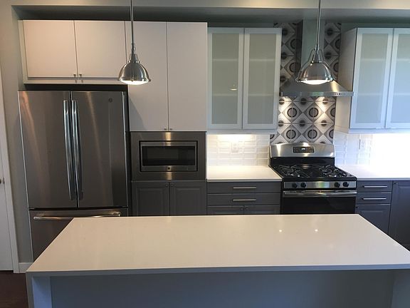 kitchen w/ island seating and built-in microwave