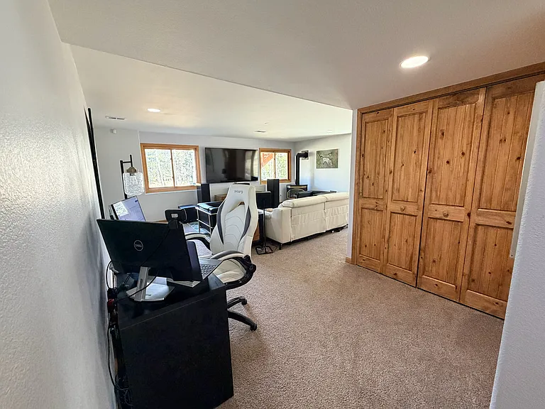 Outside of bedroom #4 with full living space. Washer & dryer are down here as well as full bathroom