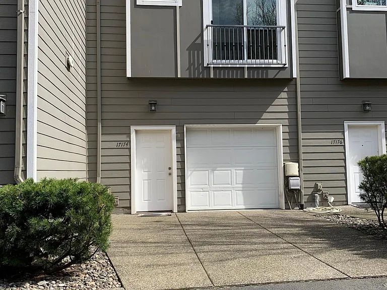 Rear entrances to garage and townhome