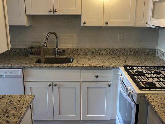 Kitchen with gas stove/oven and microwave, dishwasher, garbage disposal