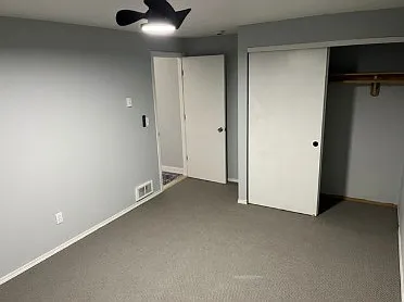 2nd bedroom with closet and ceiling fan