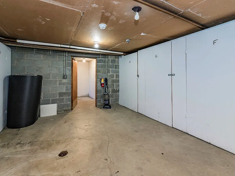 Clean dry basement with private secure storage areas for each apartment
