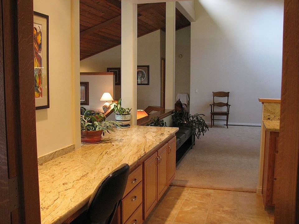 Desk area with granite counters in the kitchen.