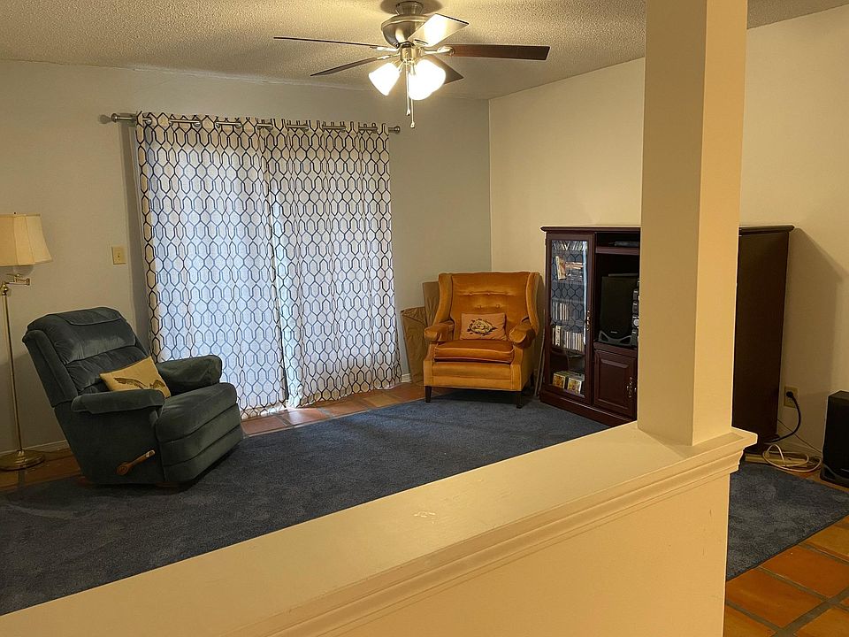Living room with sliding glass doors to private patio area