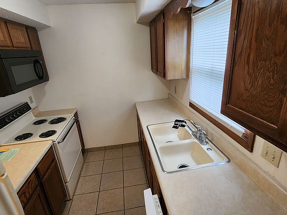 Kitchen with built-in microwave