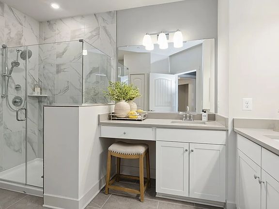 Primary bath with split vanities and shower
