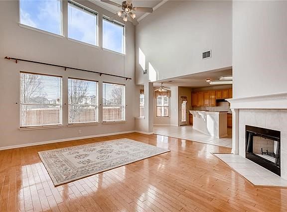 Large living area with wood burning fire place.