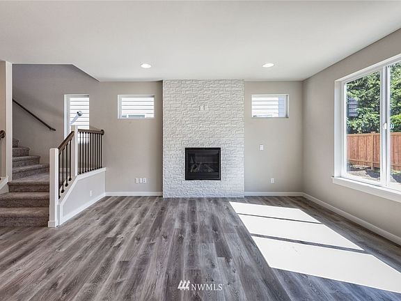 Photos are of the Huntington plan at Holley Brooke Lot 16, and may depict enhancements and/or upgrades that are not available with every plan.