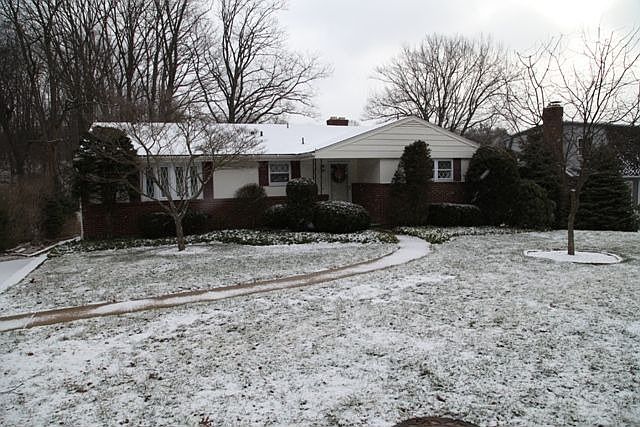 Exterior Front: Main Level Entry & a Flat Backyard