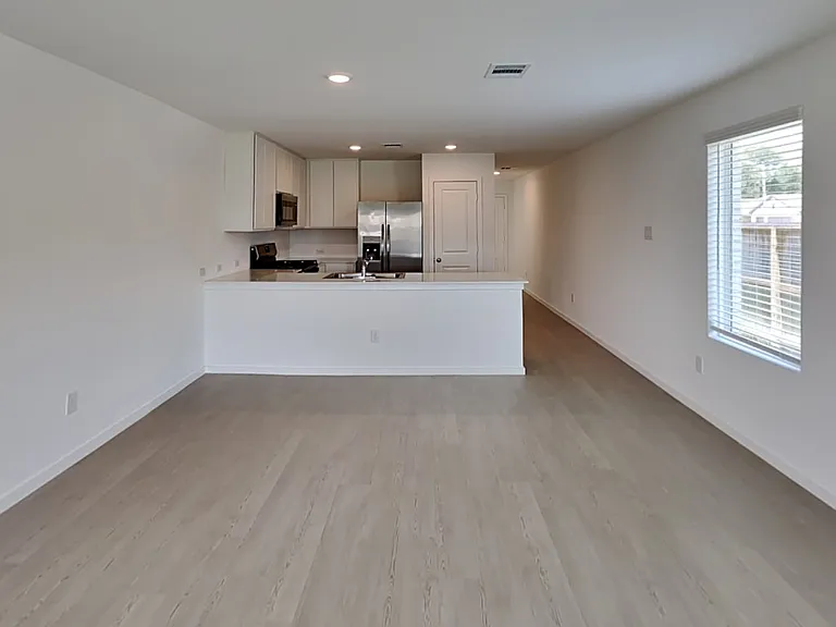 Spacious kitchen with sleek wh