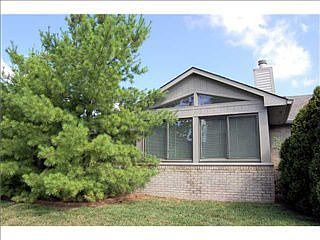 Exterior back of sun room. Lots of brick-quality Justus-built home.