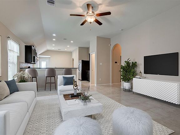16x15 Family - This is a virtual staging of what the family room might look like. Note that there is a breakfast bar where the bar stools are shown.