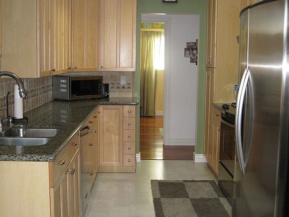 Gas range, stainless steel appliances and granite counter tops in kitchen