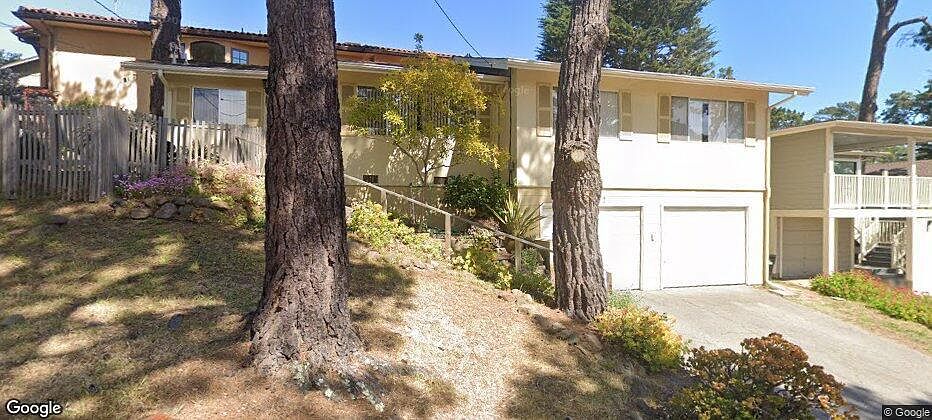 Front of the property & house with 2 car garage.