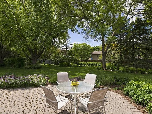 Paver patio is just a step down from the kitchen eating area.