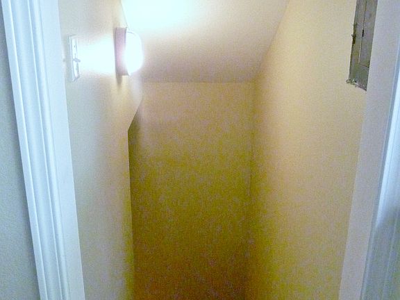 Stairs lead down to the basement