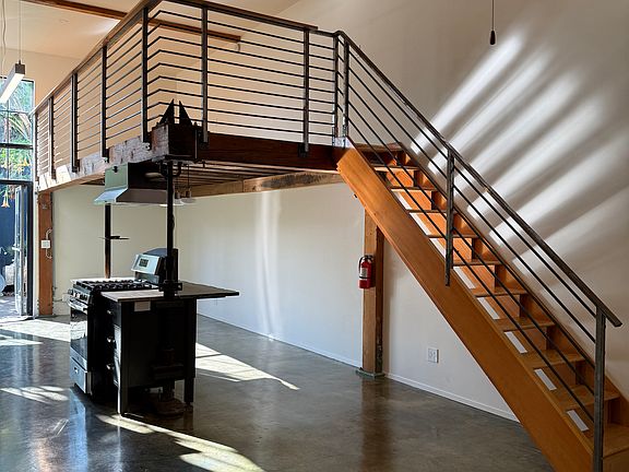 STAIRS TO LOFT, RANGE/ISLAND ON LEFT