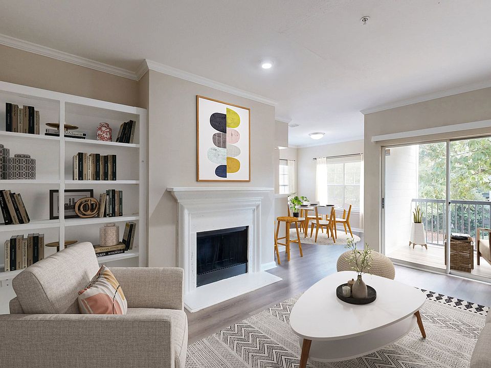 Spacious living room with separate dining area and fireplace