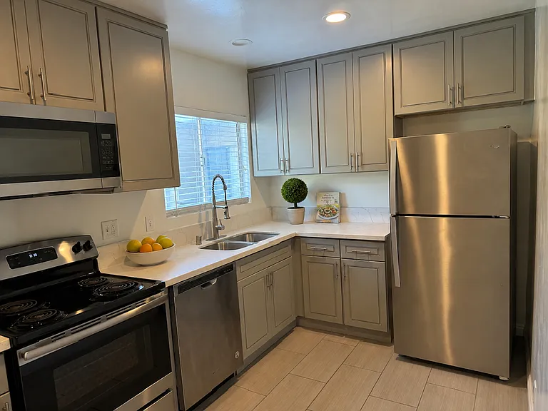 Kitchen - all stainless appliances (DW, fridge/freezer, b/i microwave, range, sink)