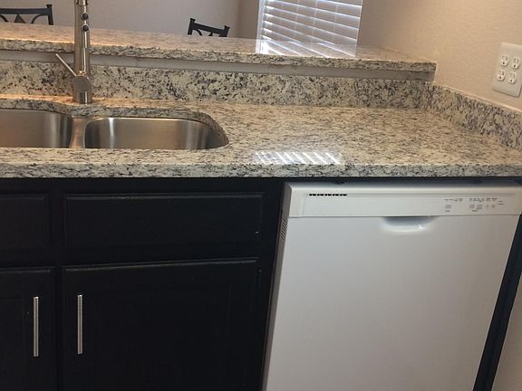 Kitchen with dishwasher and garbage disposer.