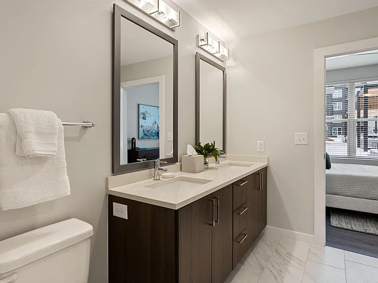 Polished Bathroom With Porcelain Tile Backsplash And Mocha Espresso Cabinets