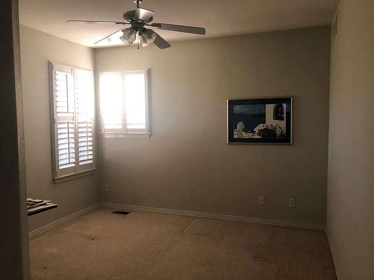 13x13 bedroom with 8 foot ceilings and fan, private bath.