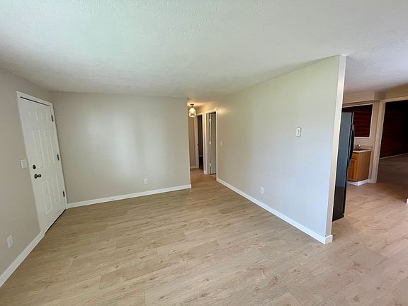 bedroom down the hall, kitchen off to the right