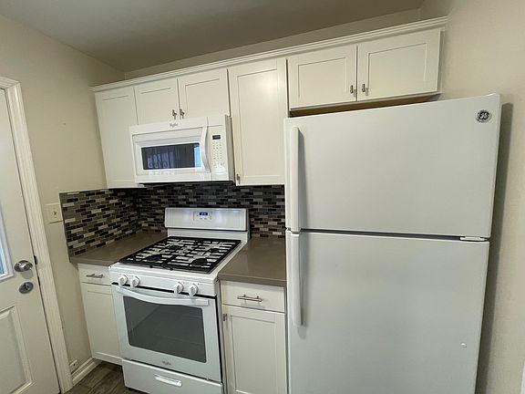 Fridge, Stove/Oven and Microwave 
Door to private patio on side yard